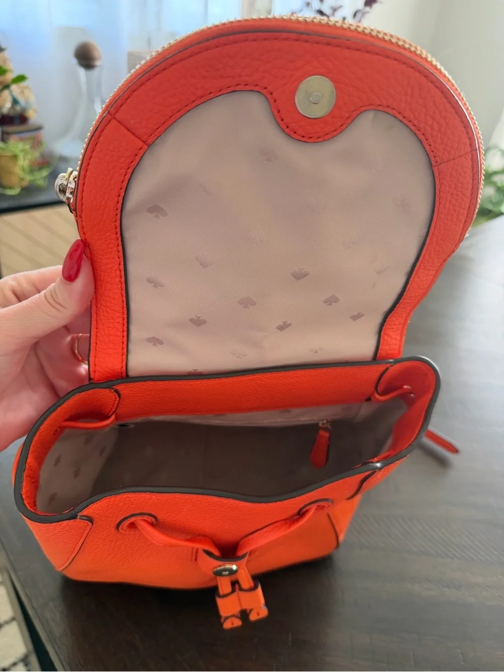 kate spade orange pebbled leather backpack with flap